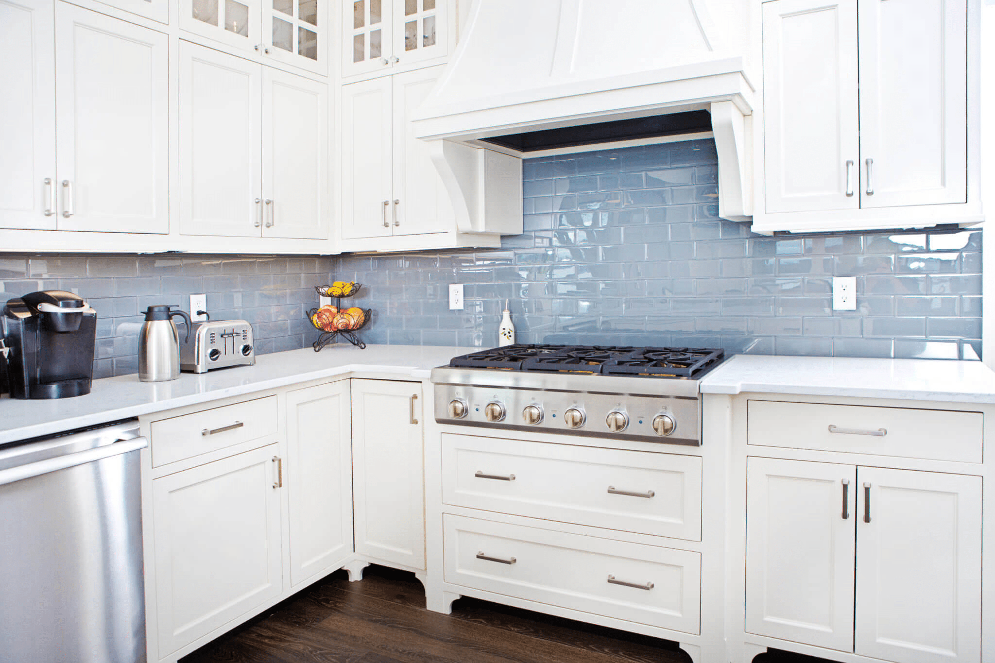 Kitchen with light blue subway tile backsplash