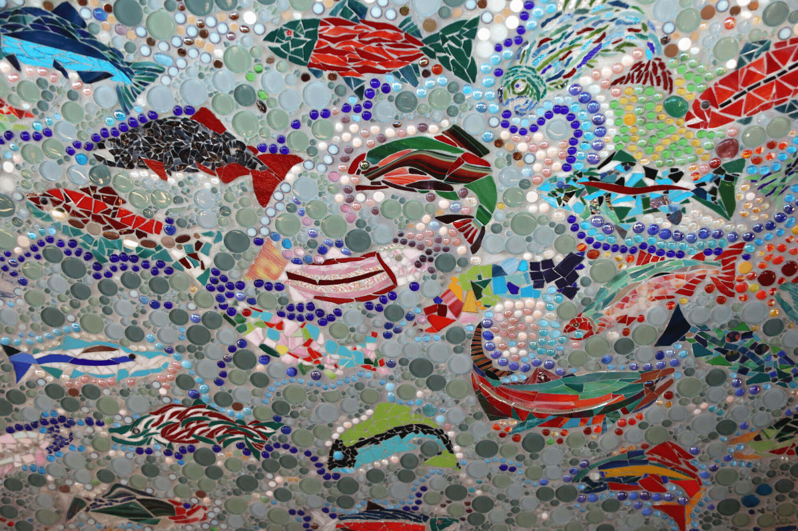 Mosaic tile mural with salmon imagery