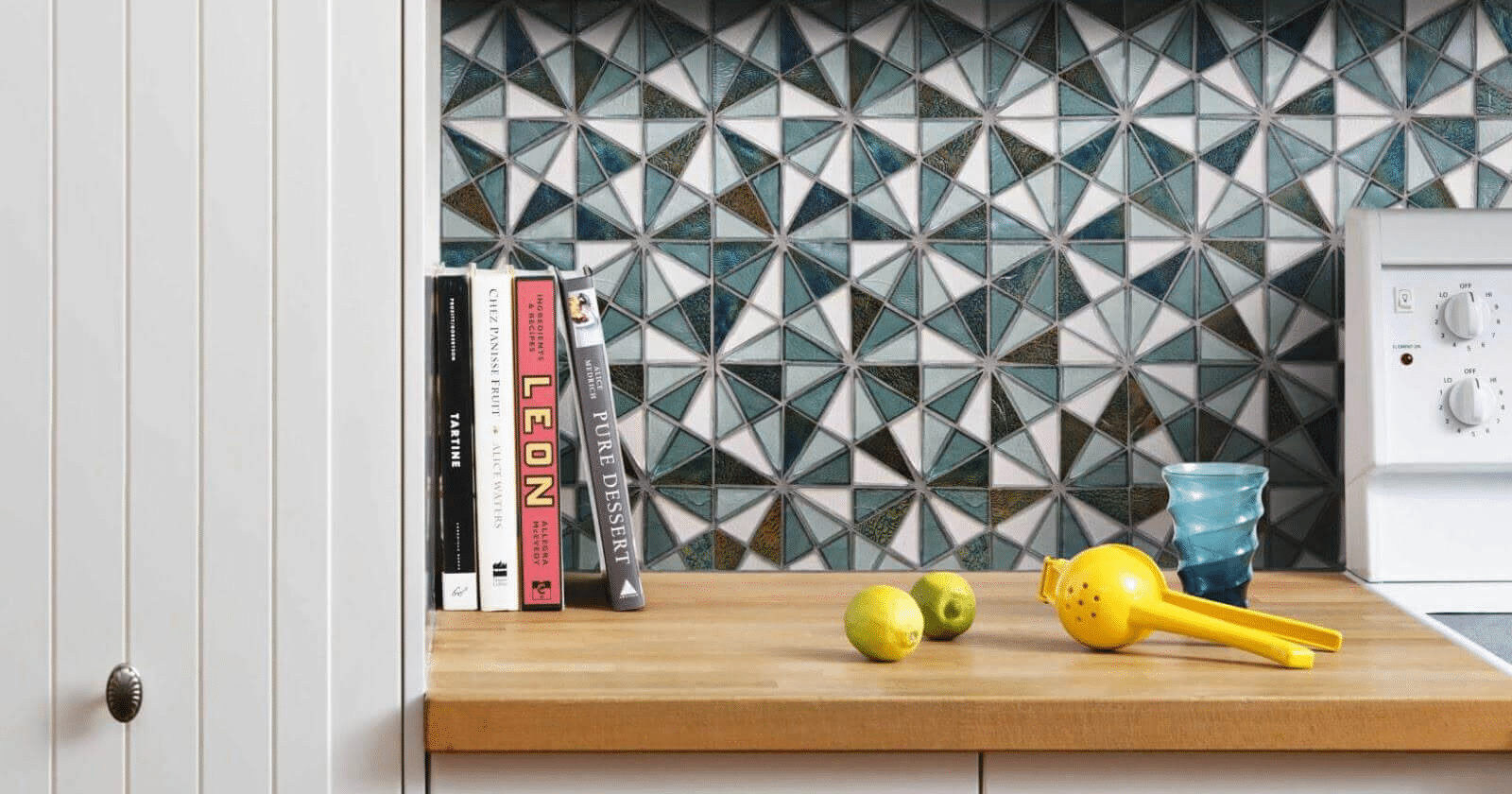 Colorful triangle mosaic tiles on a kitchen backsplash