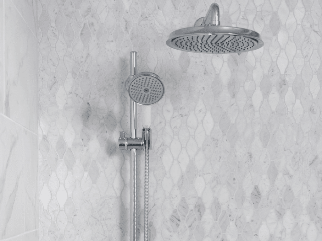 Light marble-look mosaic tile shower wall