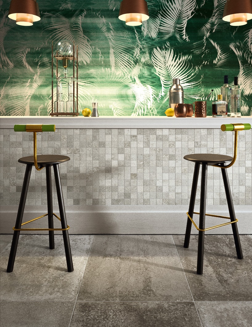 Concrete-look mosaic tile grid on a bar front