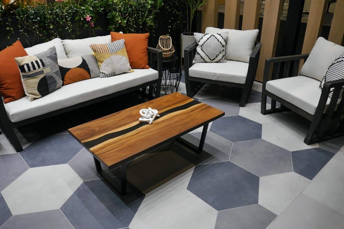 Large hex tile in varying shades of gray on an outdoor patio